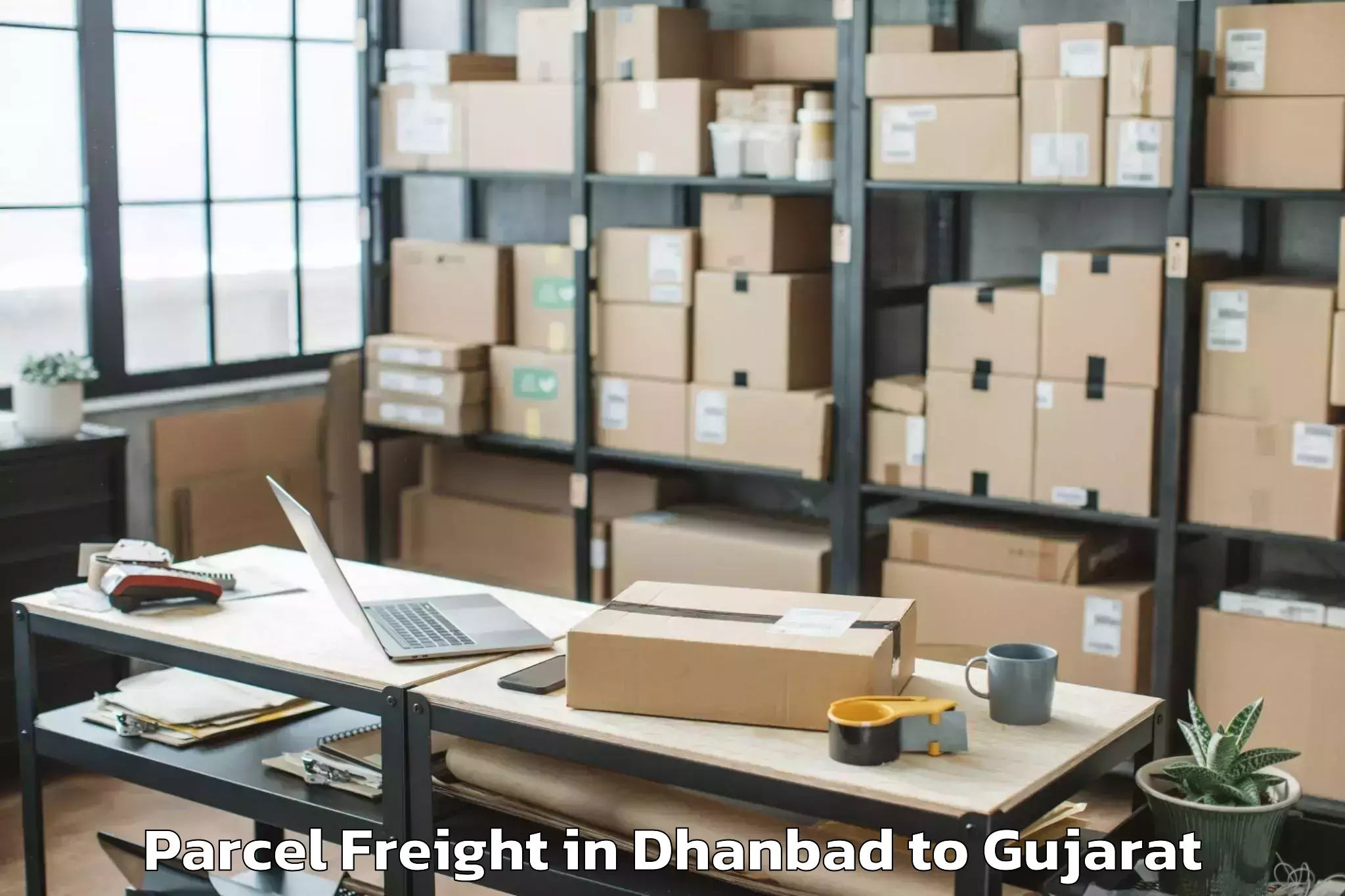 Reliable Dhanbad to Shree Somnath Sanskrit Univers Parcel Freight